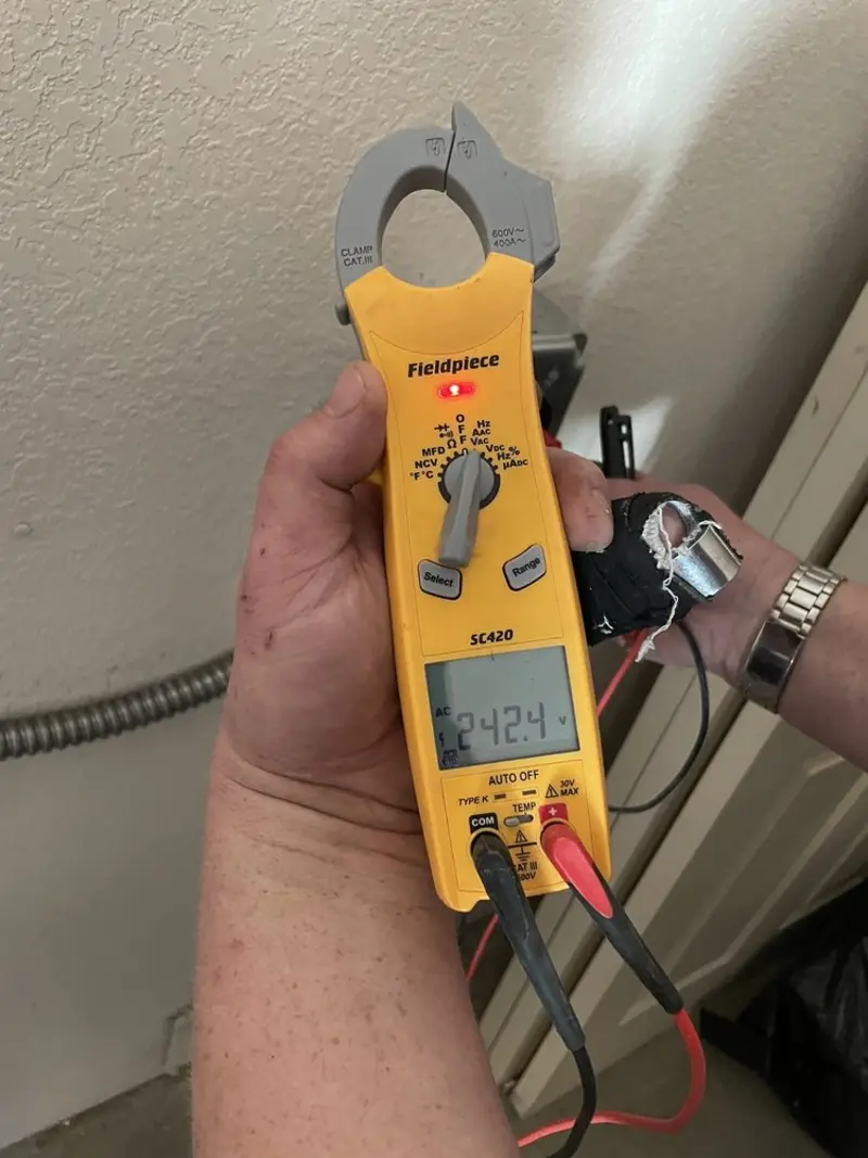 Voltage testing with clamp meter during Electrical Installation Services in Tusculum
